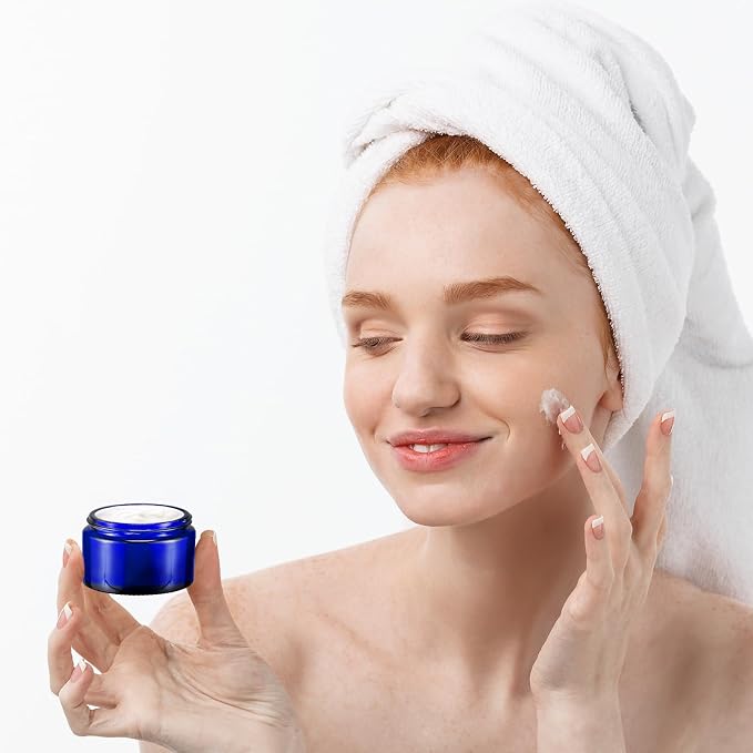 Domensi 100 Pcs 1oz Glass Jars with Lids Bulk Small Glass Salve Tins Cream Container Cosmetic Jars for Travel Balm with Inner Liners for Sample Cream (Cobalt Blue,Black Lid,Plastic Lid)