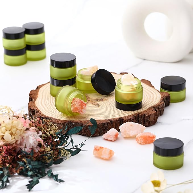 Domensi 100 Pcs 1oz Glass Jars with Lids Bulk Small Glass Salve Tins Cream Container Cosmetic Jars for Travel Balm with Inner Liners for Sample Cream (Bean Green,Black Lids,Plastic Lid)