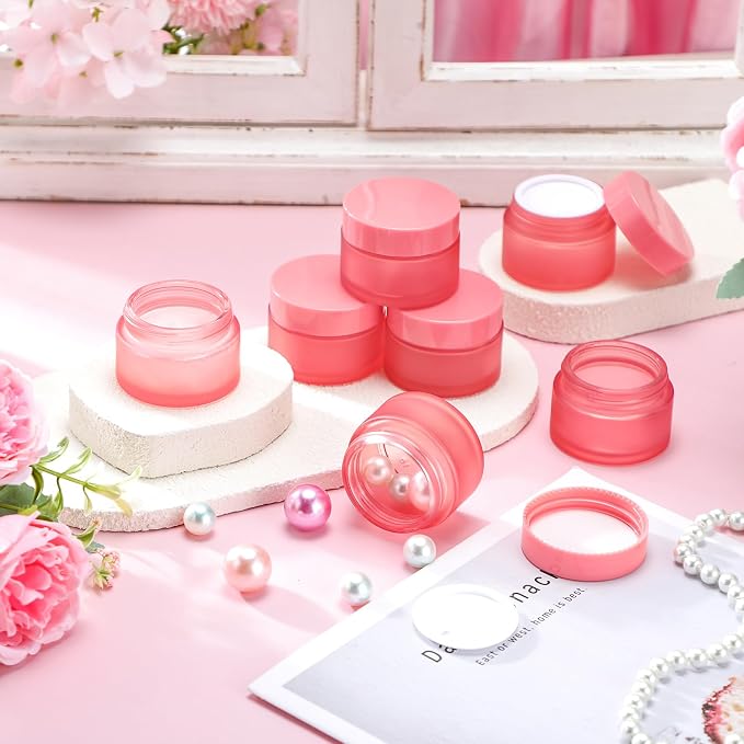 Domensi 100 Pcs 1oz Glass Jars with Lids Bulk Small Glass Salve Tins Cream Container Cosmetic Jars for Travel Balm with Inner Liners for Sample Cream (Pink,Pink Lid,Plastic Lid)